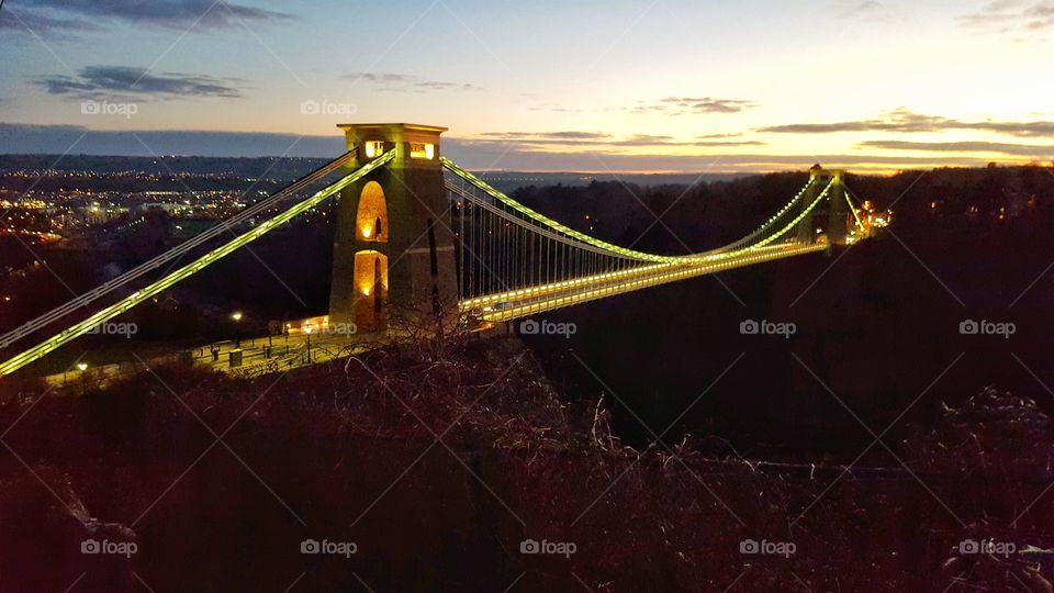 illuminated Bristol Clifton suspension bridge at dusk