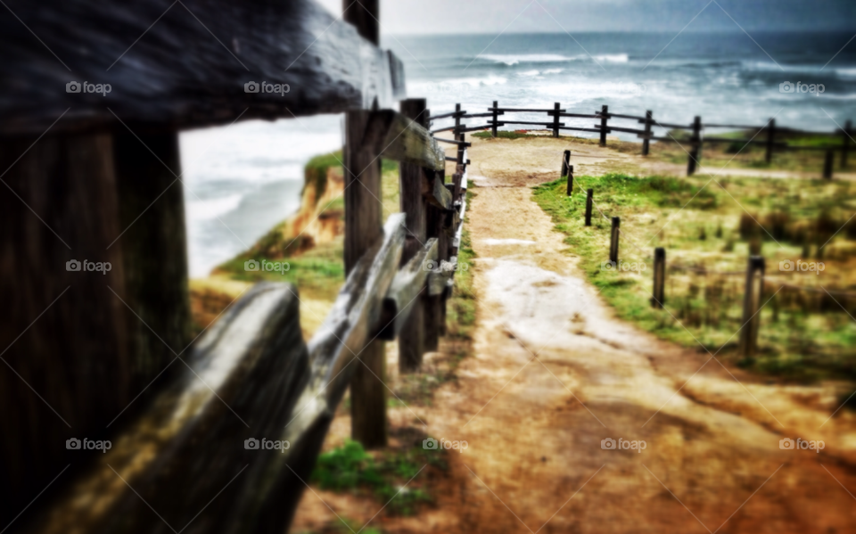 ocean fence morning rain by runtographer