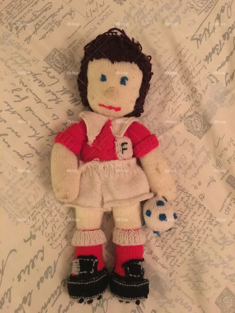 Handmade footballer knitted by Grandma. Very old and a bit dirty. Found in a box under the bed. Still cute! 