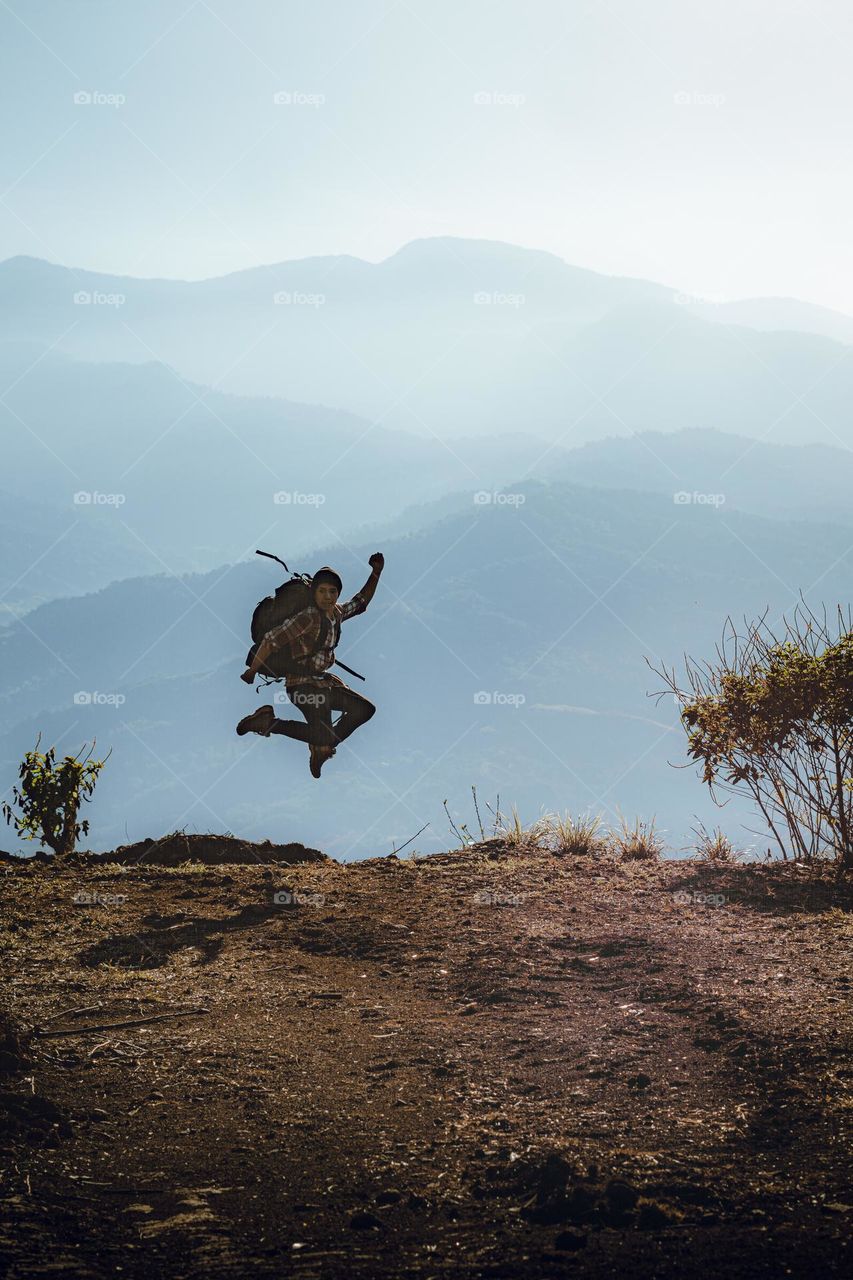 The photo of the week, is a hike to the mountain, where there is a boy jumping with mountains in the background