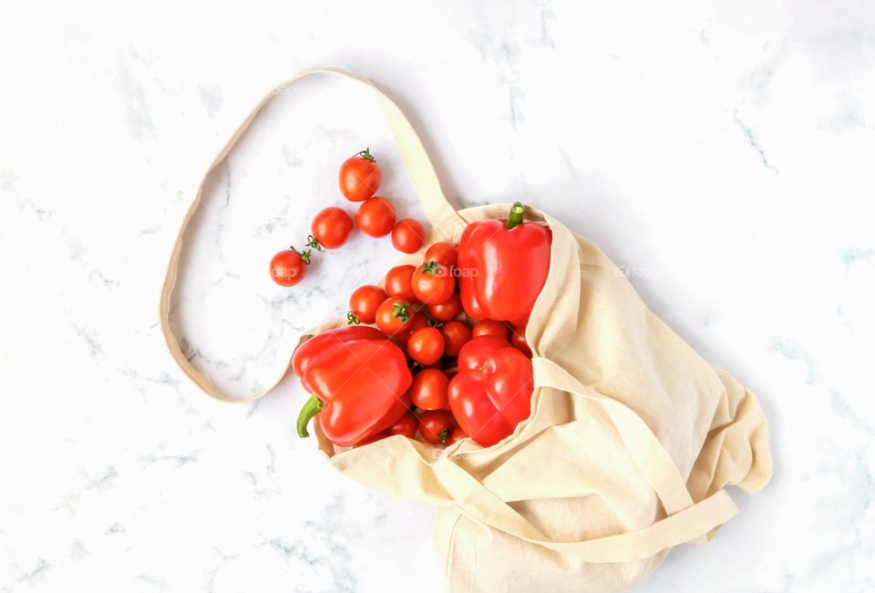 Red vegetables in linen bag.