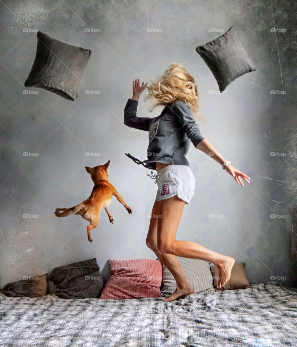 jumping girl with her dog 