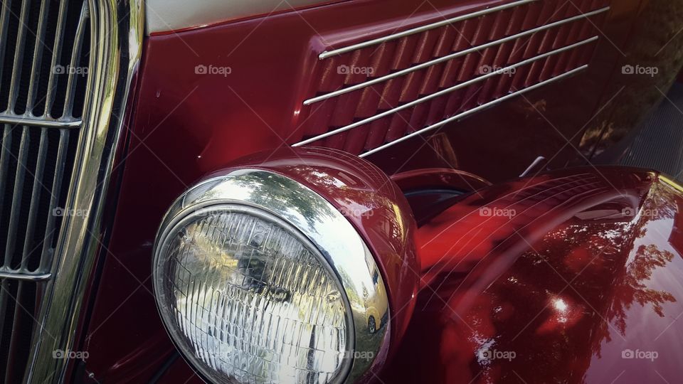 At a car show I took this picture of a section of a vintage ford roadster to show the shapes, the lines and the chrome.