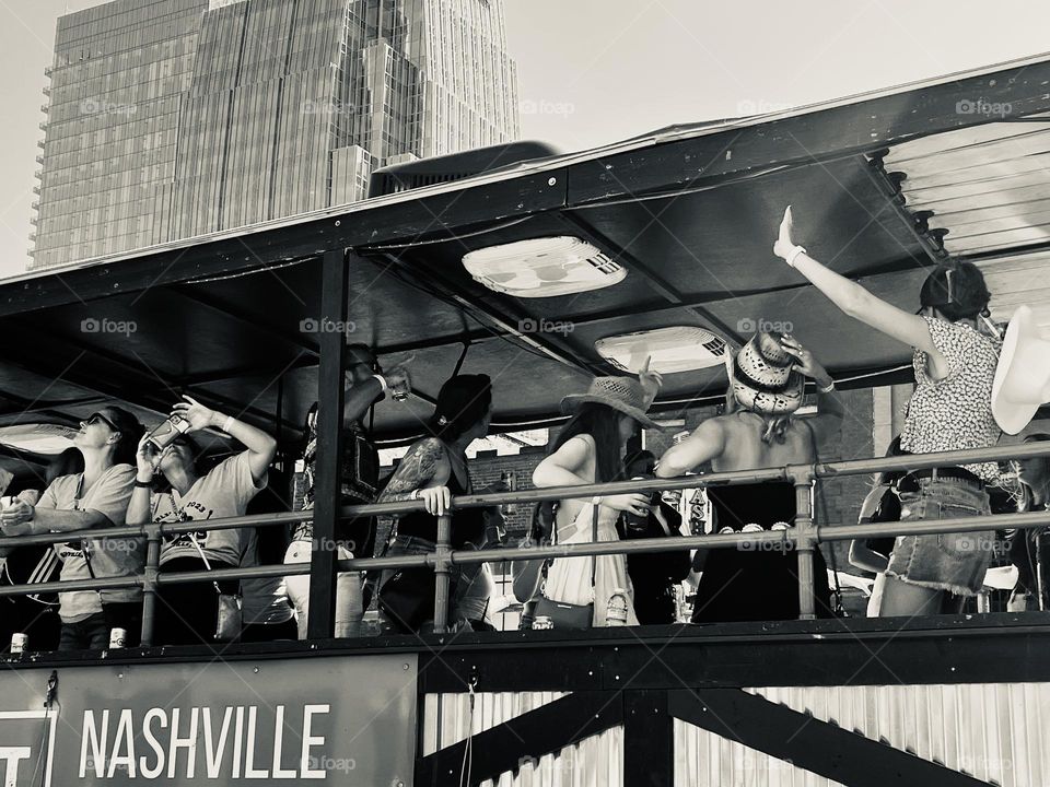 Women having fun dancing on a party bus girls trip in Nashville US