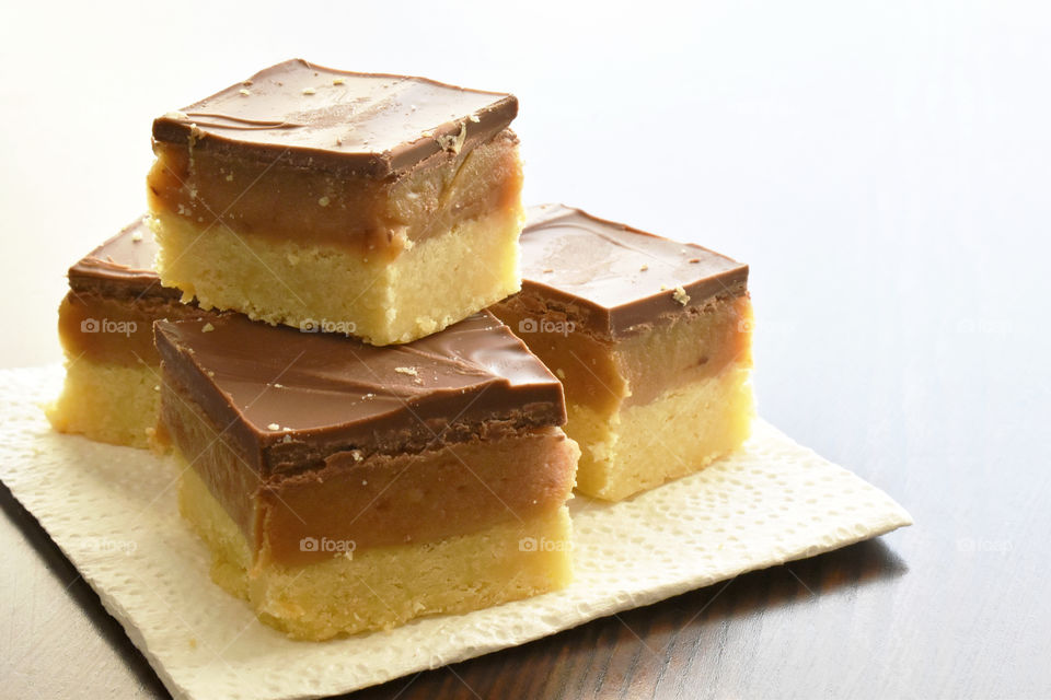 Millionaire's shortbread, caramel shortcake, or millionaire's slice. Copy space is on the right side.
