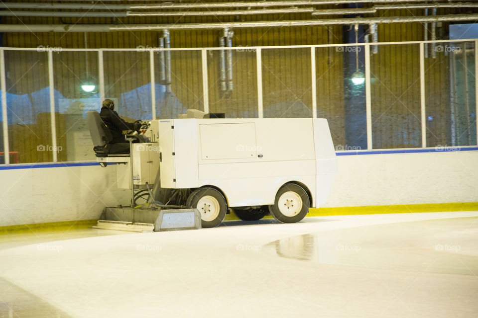 Ice resurfacing machine in work.
