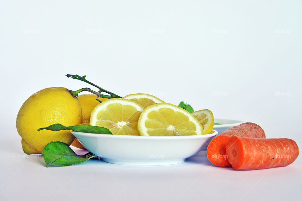 Lemon fruits with carrots