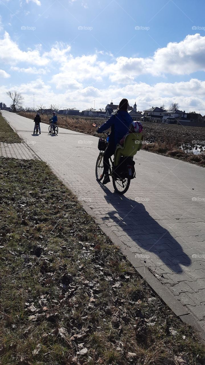 family bicycle ride on sunny day