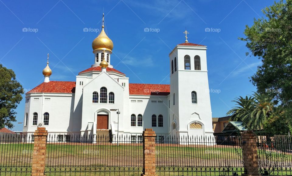 An external view of a Christian  Orthodox Church against a blue sky, Sydney, Australia.