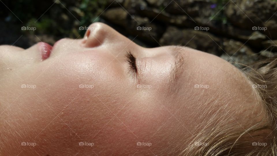 girl's face with closed eyes