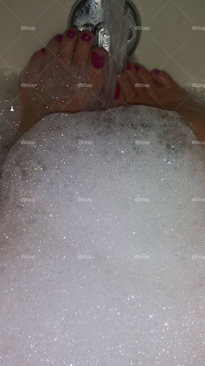 Wet feet in bubble bath