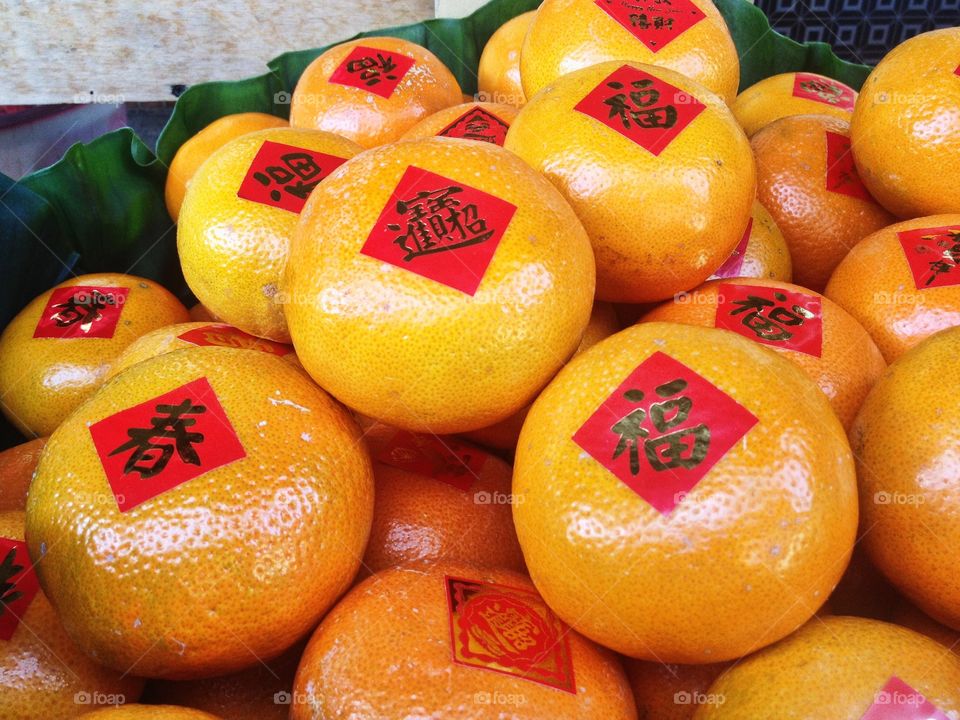 Tangerines and oranges symbolize luck, prosperity and wealth in the Chinese culture. The bright orange color symbolizes gold. So tangerines and oranges are important symbols in Chinese New Year celebration. 