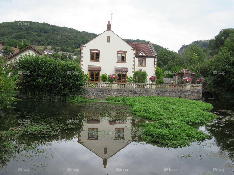 House with reflection on lake