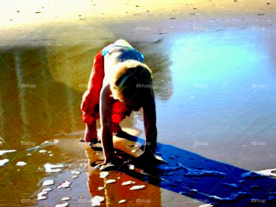 Boy Playing In The Sand 