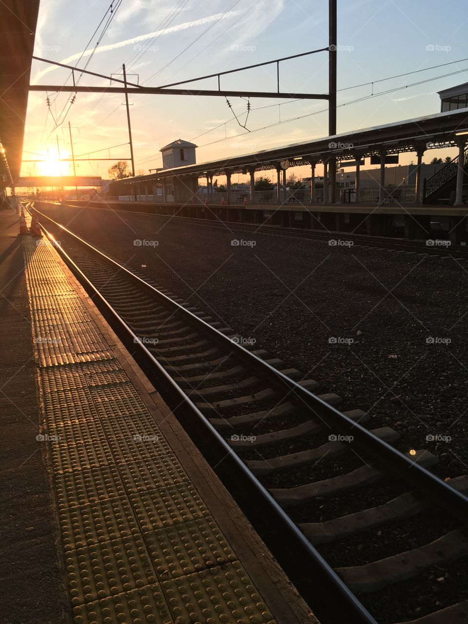 Waiting on the train to arrive while the sun sets in Lancaster, Pennsylvania 