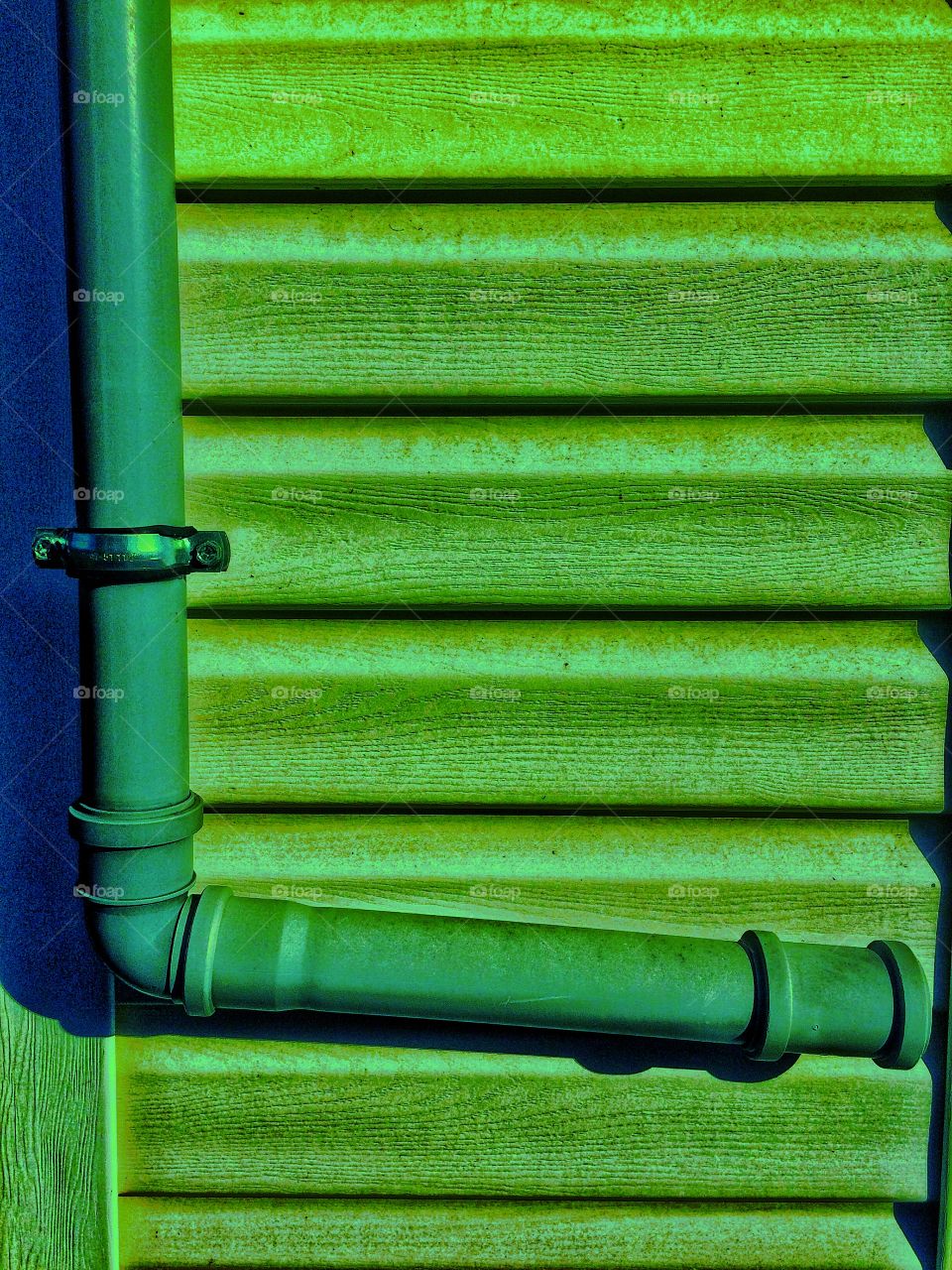 Green wooden wall and plastic tube texture 