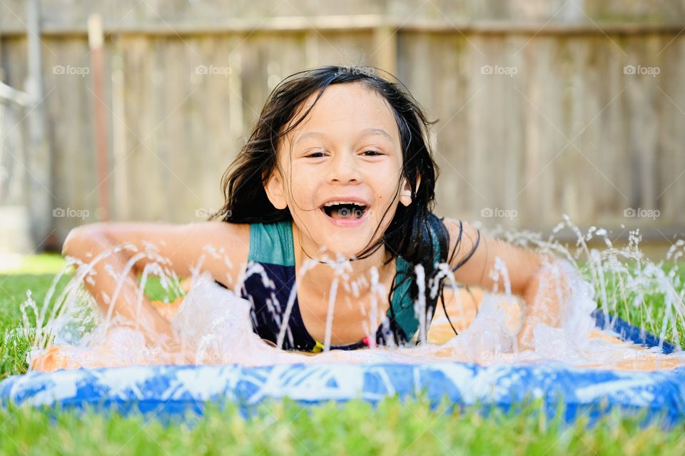 Happy face for water fun of the hot season and no school .