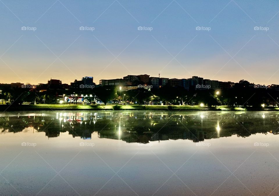 Seeing Double? 🇺🇸 The image of the neighboring buildings of Lago do Taboão in Bragança Paulista, reflected in the water. / 🇧🇷 A imagem dos prédios vizinhos do Lago do Taboão em Bragança Paulista, refletida na água.