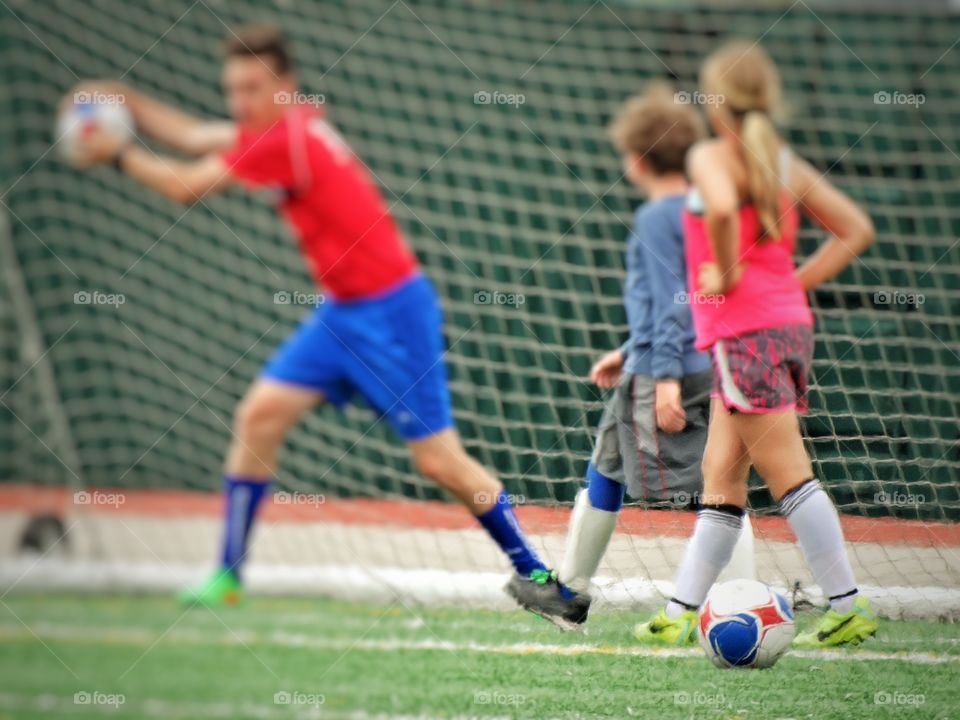 Kids Playing Soccer. Children At Soccer Camp
