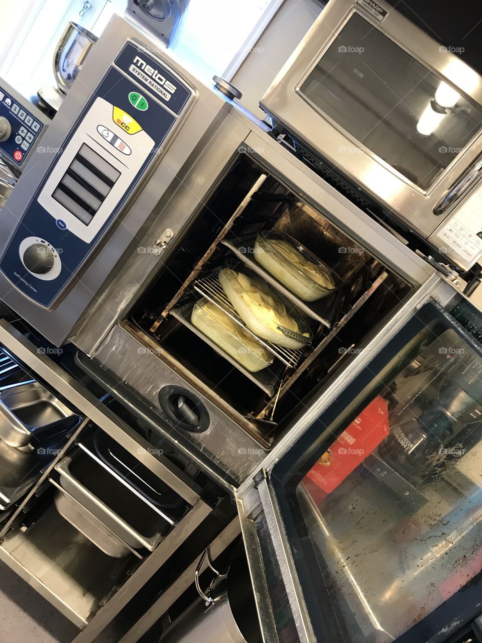 Kitchen equipment. This is a common oven to see inside big kitchens. Works like a normal oven, just a bit bigger and more practical. Fancy.