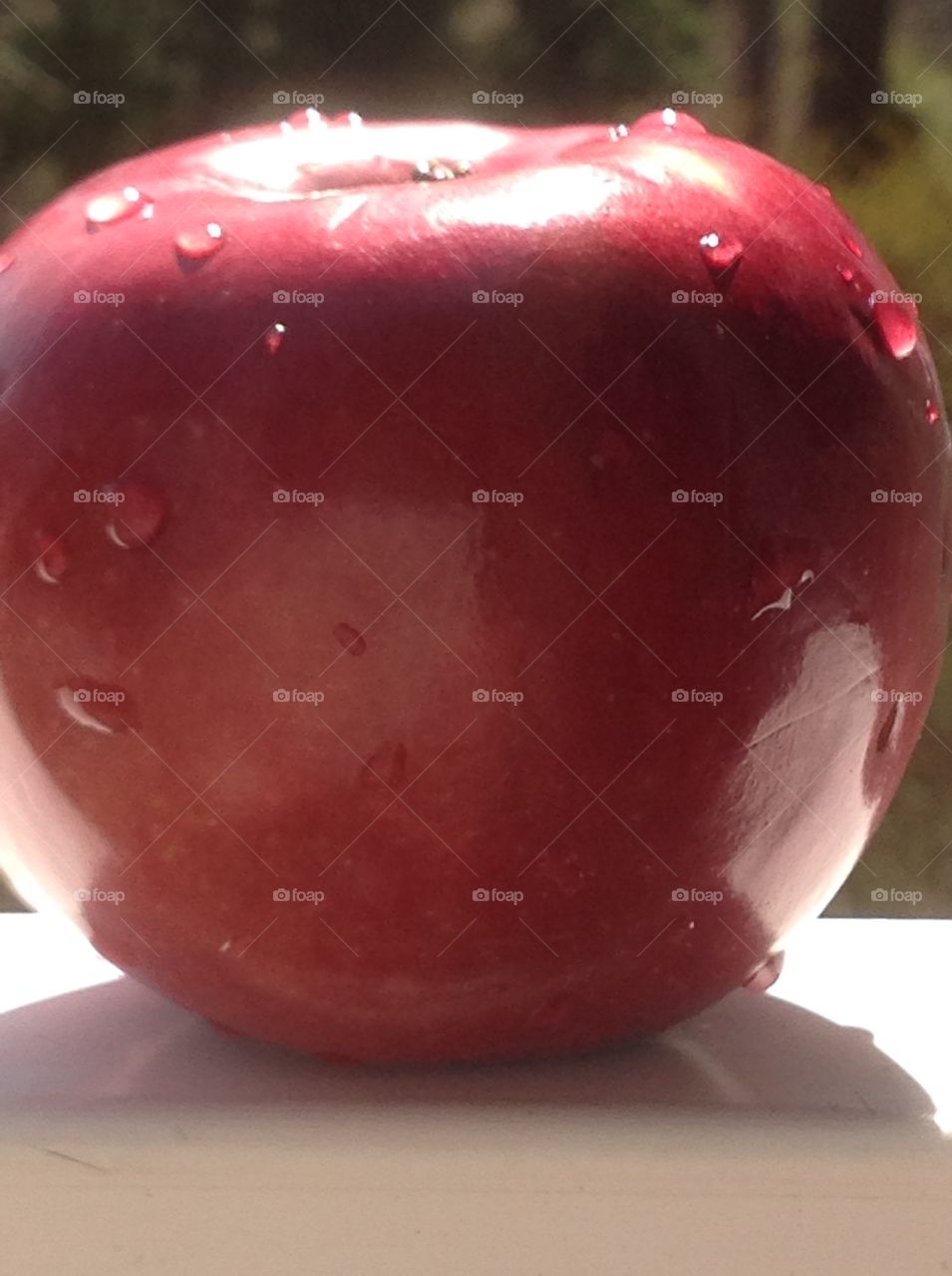 A close up shot of a red delicious apple. 