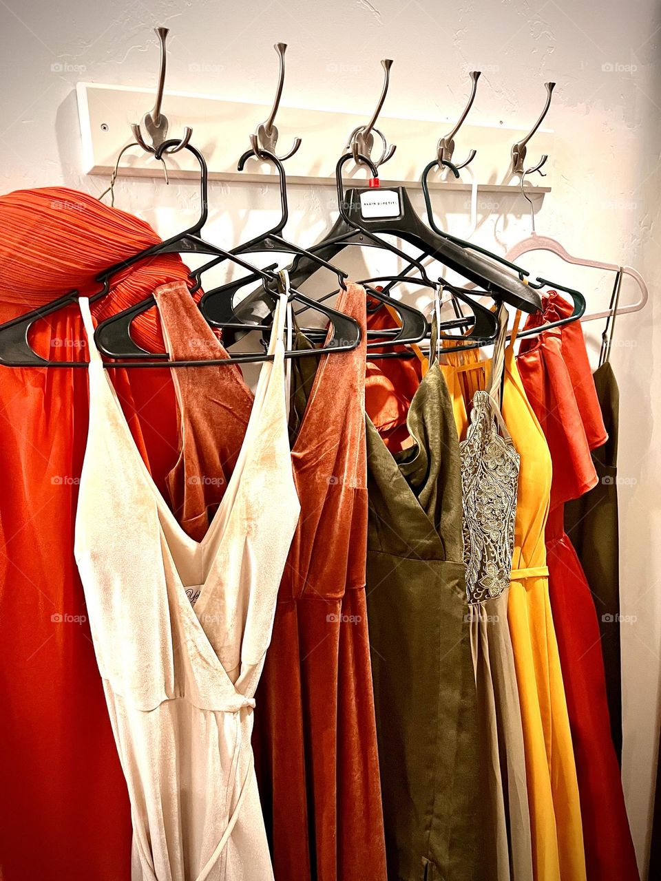 Bridesmaid dresses await the special moment as the ladies primp and prep together 