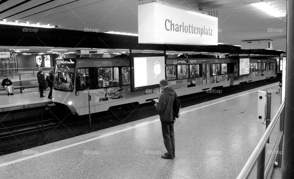 a lonely man at the subway station