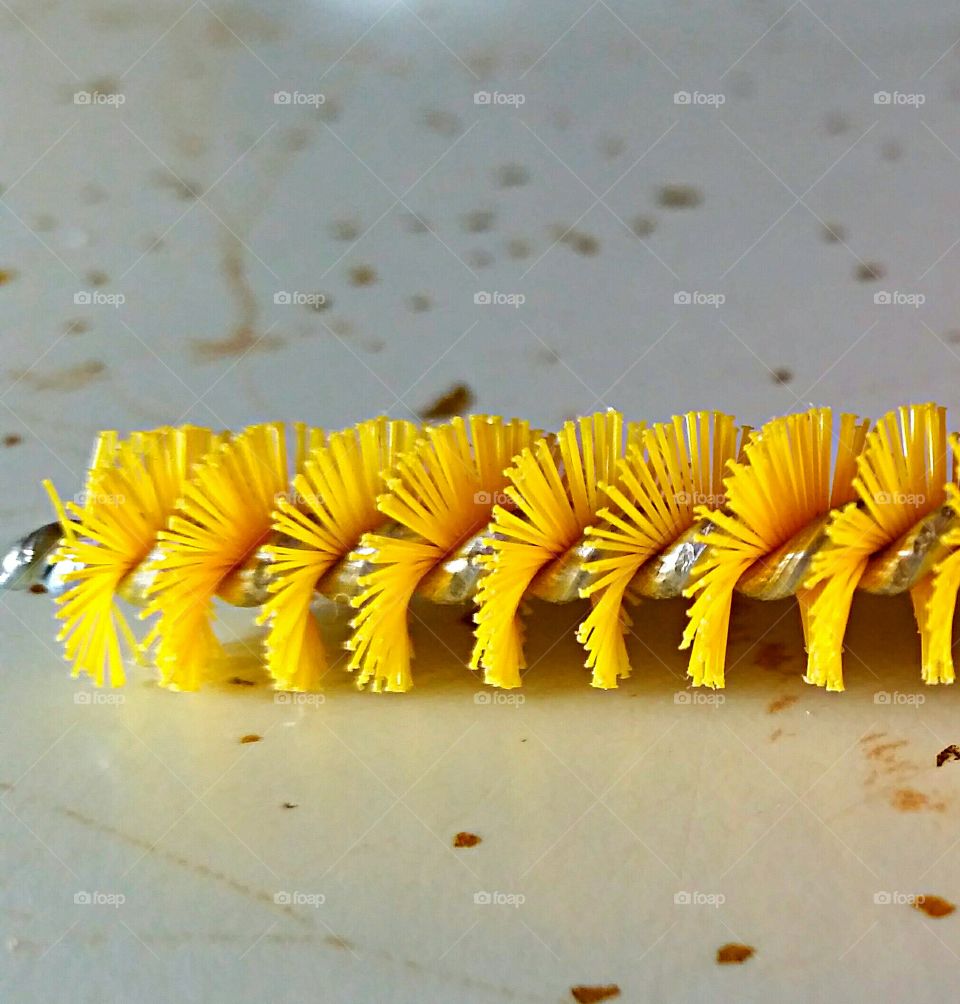 Yellow Brush Bristles . Bright yellow brush bristles up close.