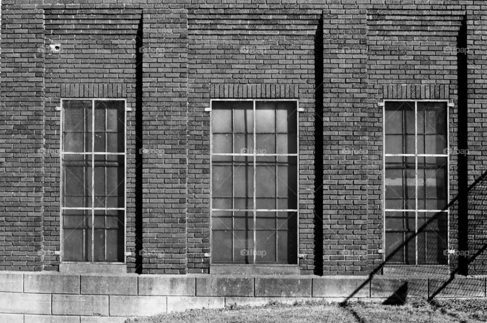 Brick building with three windows 