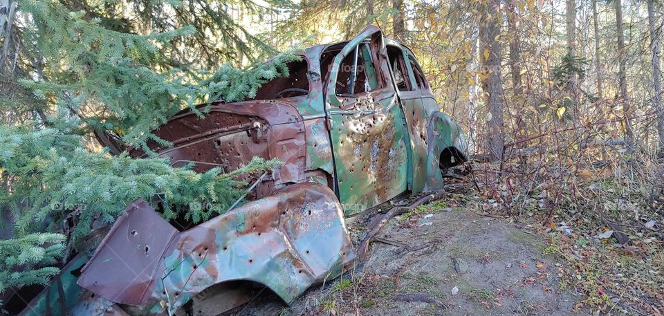 old car left in mountains