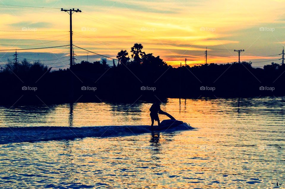 A man riding jet ski in river
