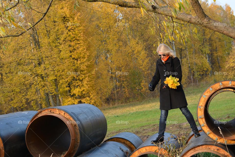 girl with autumn leaves beautiful autumn landscape