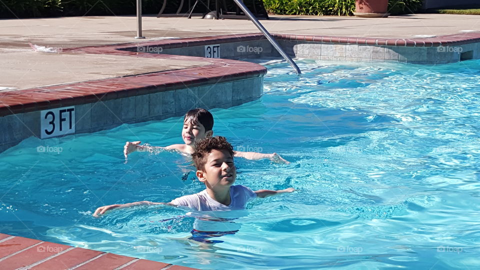 Two children in the swimming pool