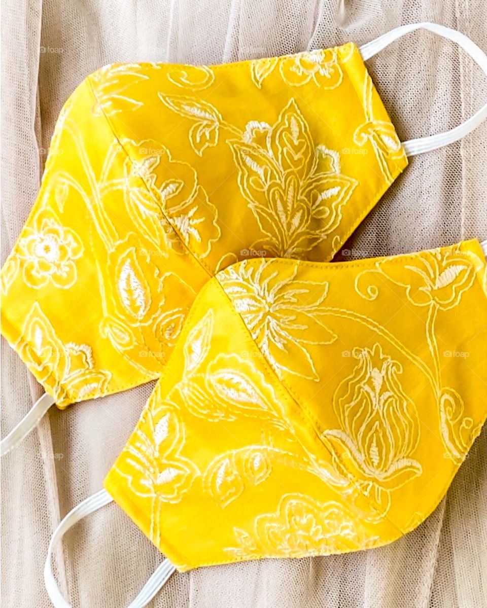 100% breathable, washable and reusable beautiful embroidered yellow masks.