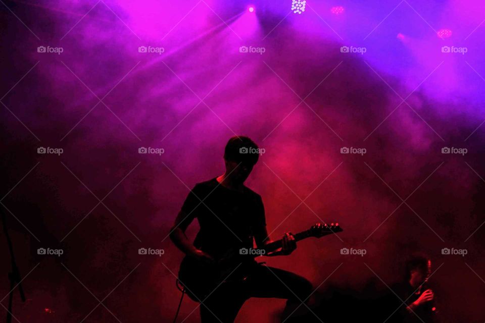 Guitarist silhouette.