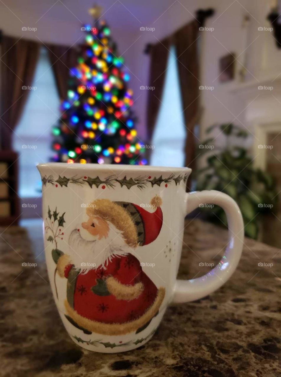 Warm beverage in a Santa mug on Christmas morning