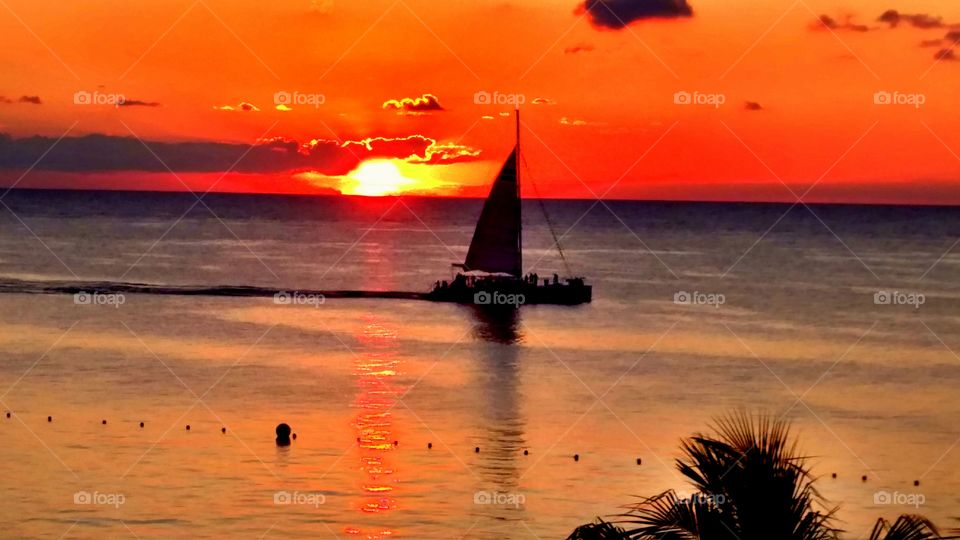 Sunset Sail. We were in Cozumel sitting at a rooftop bar watching the day sailors return.