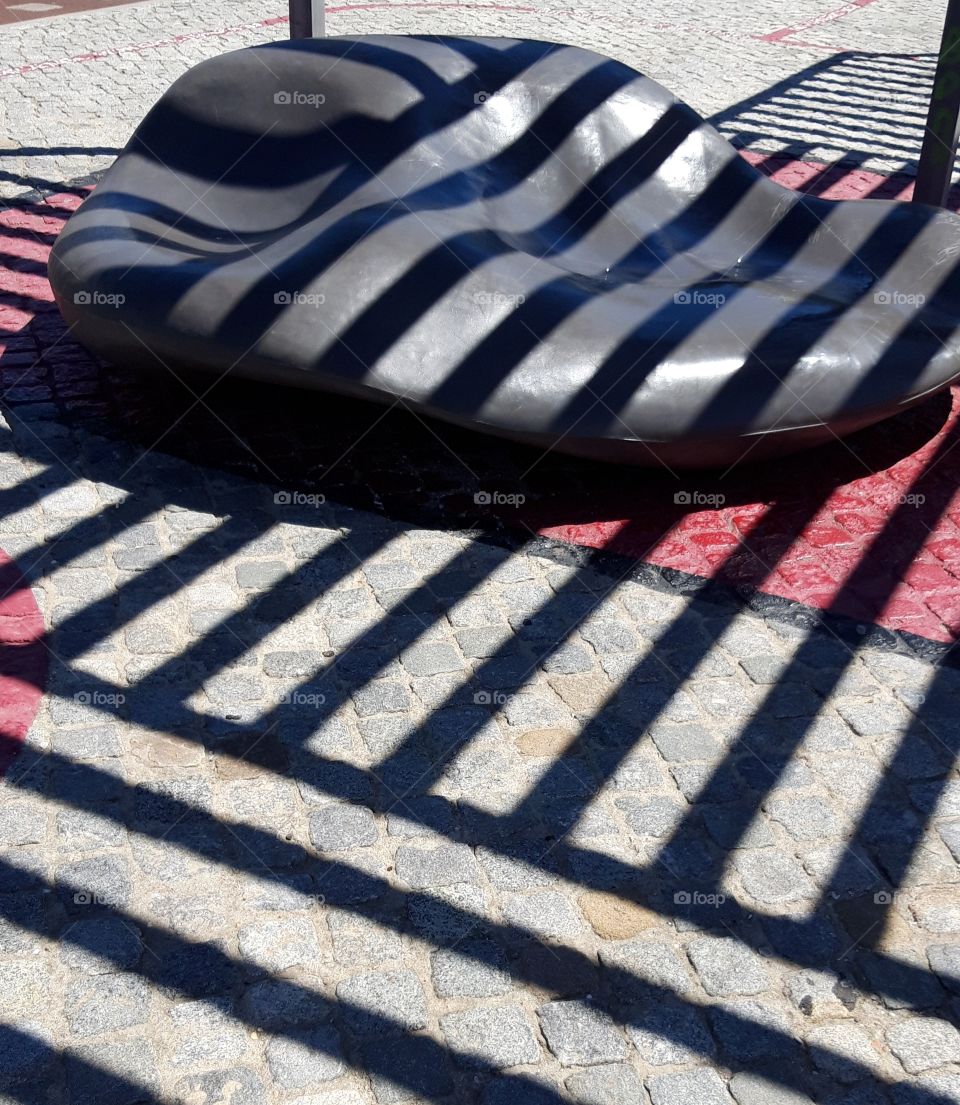 shadow on bench in Cascais