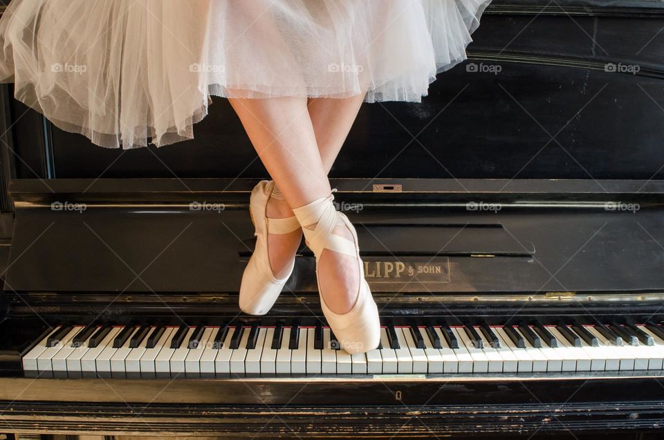 Ballerina Standing on A Piano