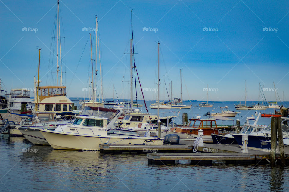 Marina boats docked in Maine, summertime coast.