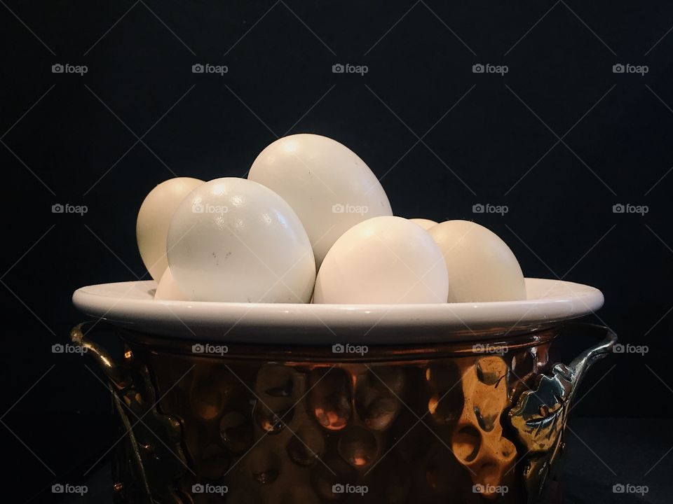 Eggs in a copper bowl