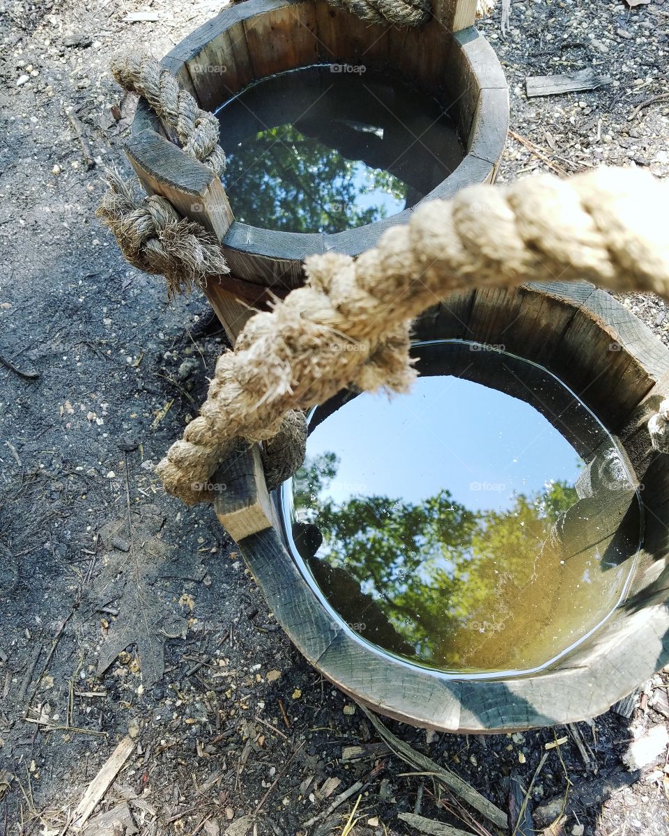 Rustic bucket water reflection