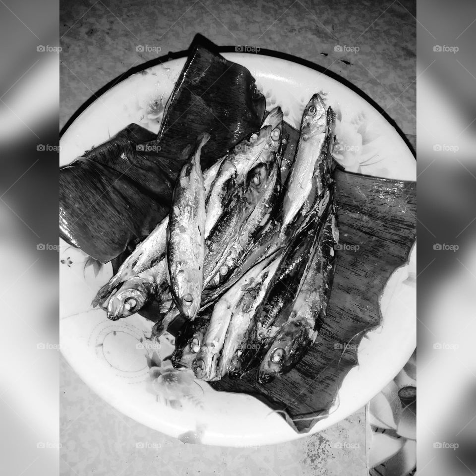 Cooked fish in banana leaves