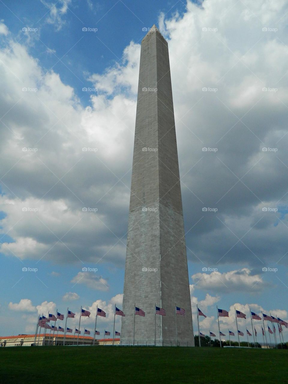 The Washington Monument stands day and night as America's tribute to our first President. The fifty American flags that encircle the base of the Monument represent our fifty States and, at the same time, symbolize our enduring Federal Union.