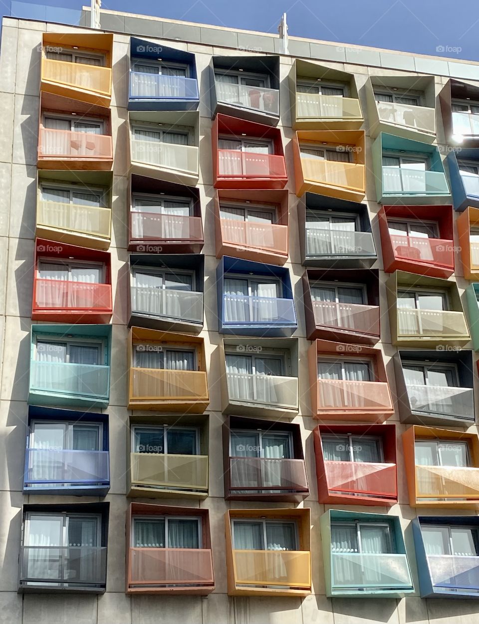 Modern building with multicolored balconies