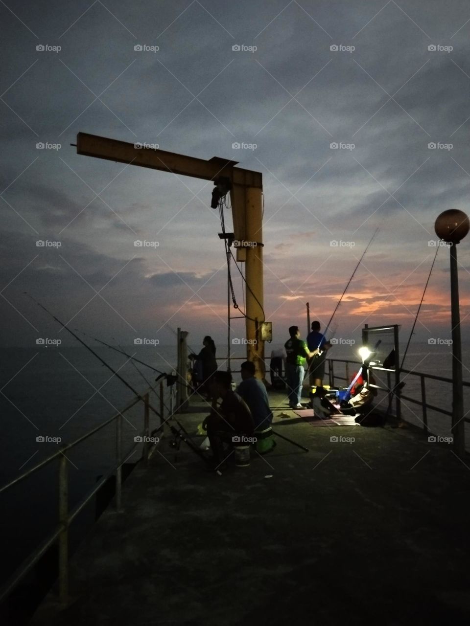 Fishing on the bridge.