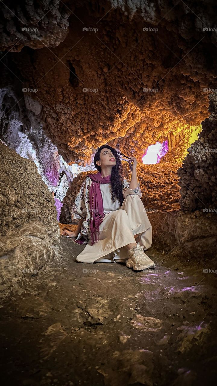 The curly-haired girl in the coral cave