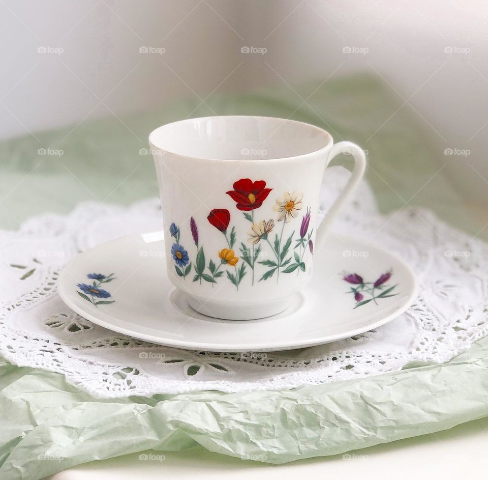 Antique porcelain tea set - cup and saucer with meadow flowers pattern