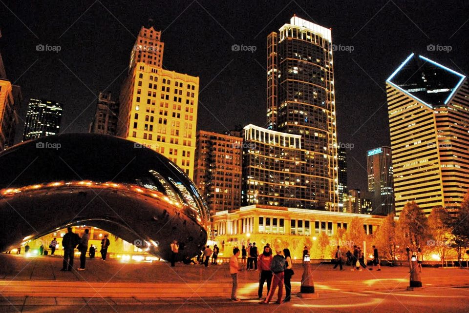 Cloud gate at night. The cloud gate sculpture in Chicago reflecting skyscrapers in the Chicago night sky