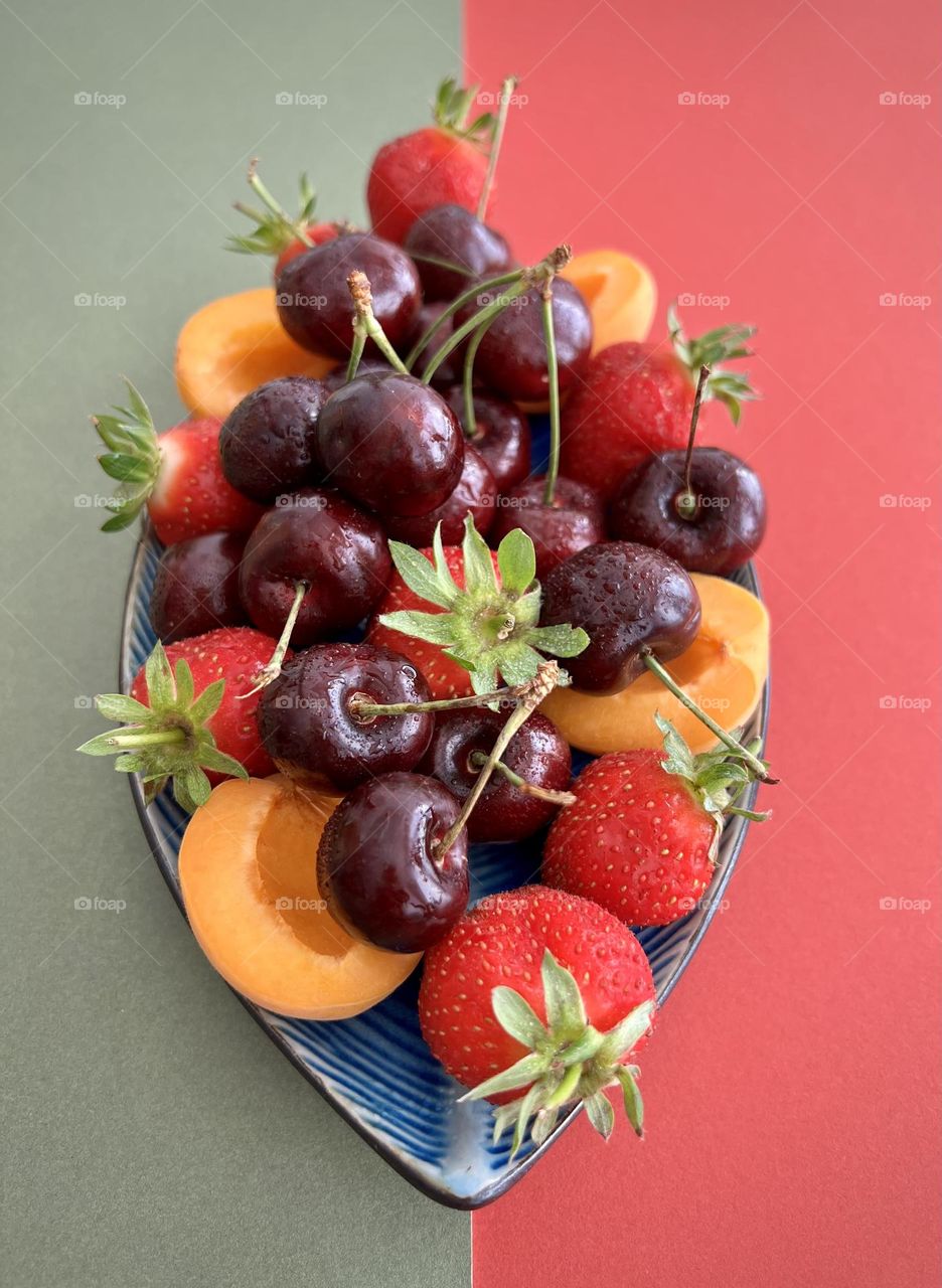 Summer treats, summer time, summer mood. Refreshing snacks. Delicious summer berries and juicy apricot. 